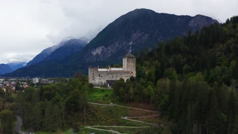 Aerial-View-Of-Castle-Bruck-Beside-River-Isel-In-Austria