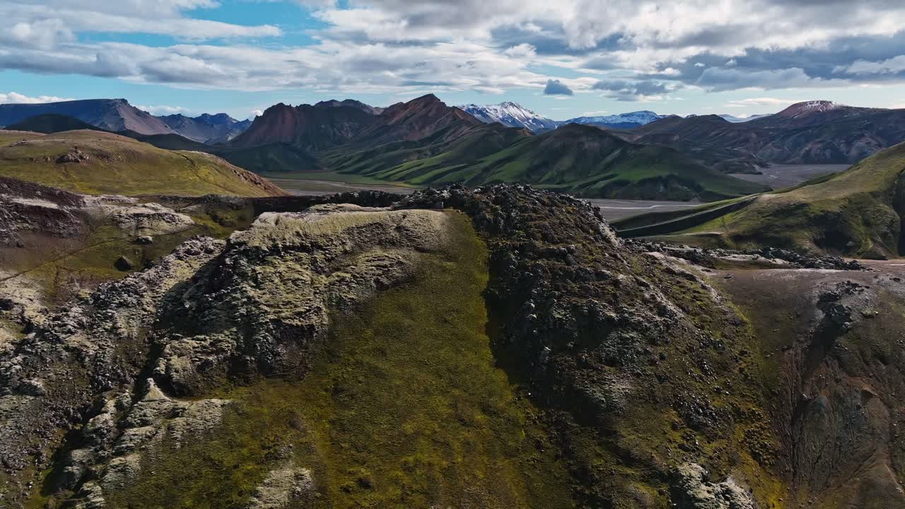 Picturesque mountain landscape with green valley and cloudy sky