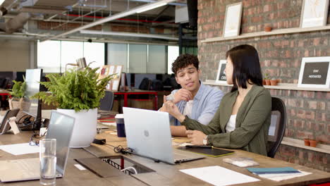 discussing ideas for interior design project, multiracial colleagues collaborating in modern office