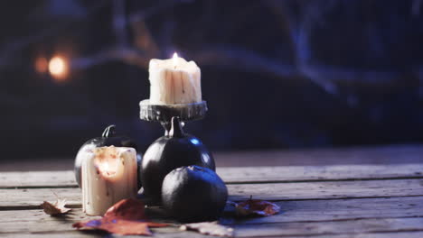 candles provide a warm glow on a rustic wooden surface