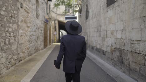 jewish man walking in the old city of jerusalem