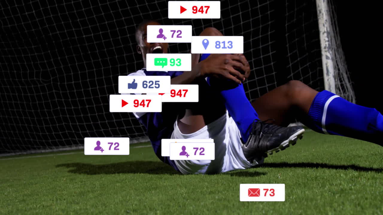 Social media reactions animation over soccer player lying on field holding leg