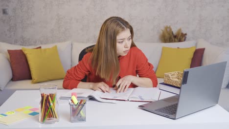 young girl studying online from home with remote teacher.