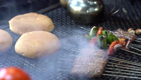 bread and skewers on the bbq, in the streets of marrakech, morocco