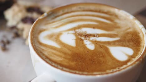 latte with art and cookies