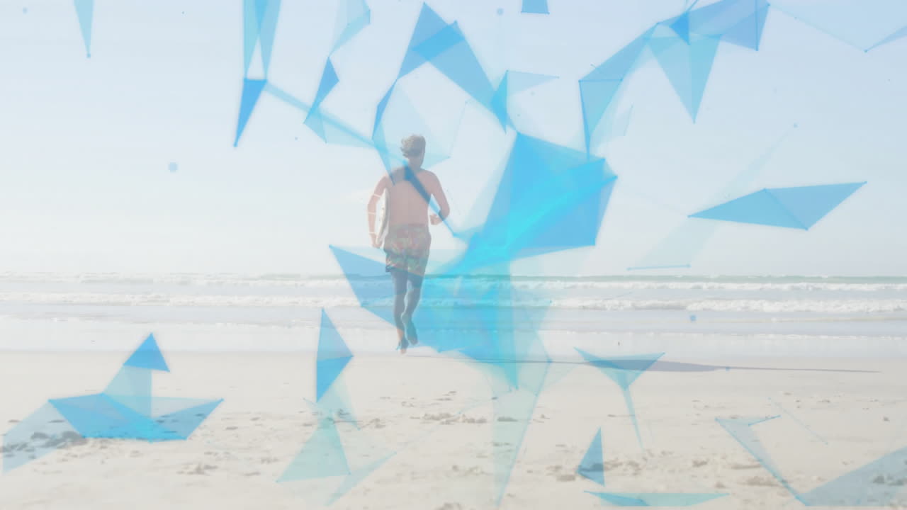 Man walking barefoot along sandy beach, with floating blue triangles visualizing technology overlay
