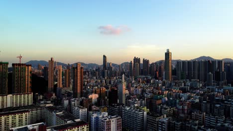 drone shot over kowloon in hong kong at dusk