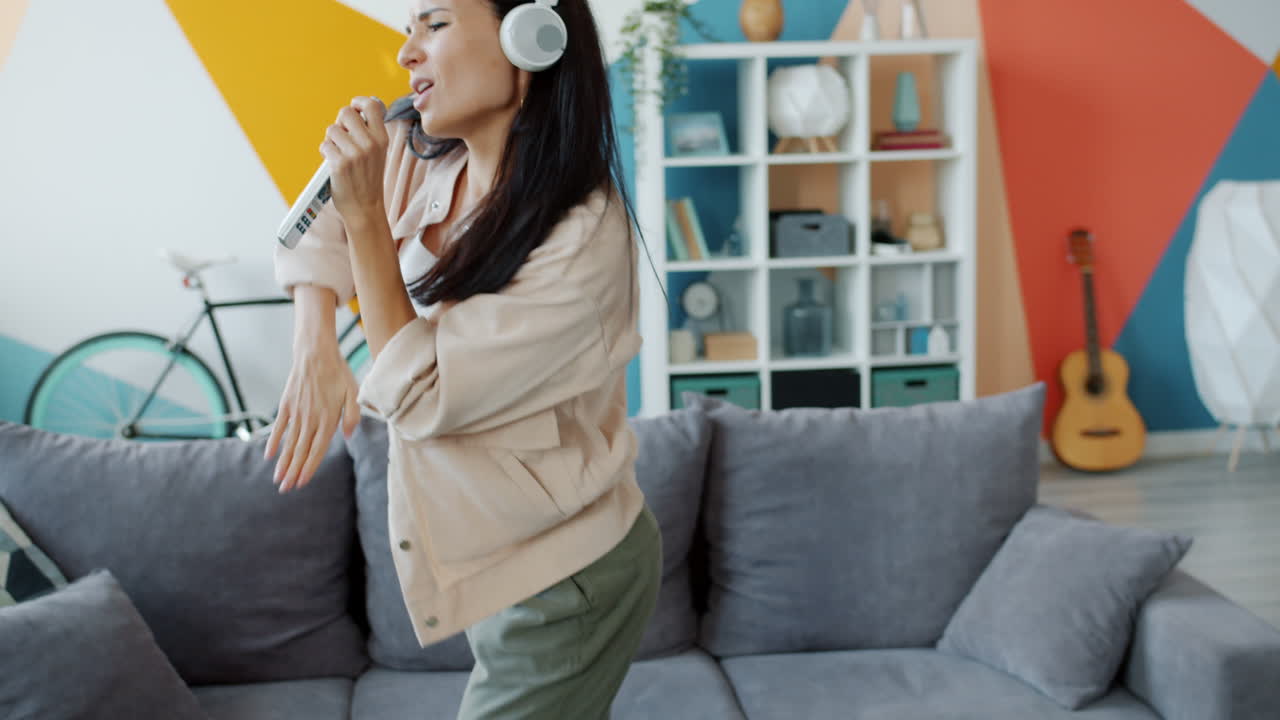 Woman Singing and Dancing at Home