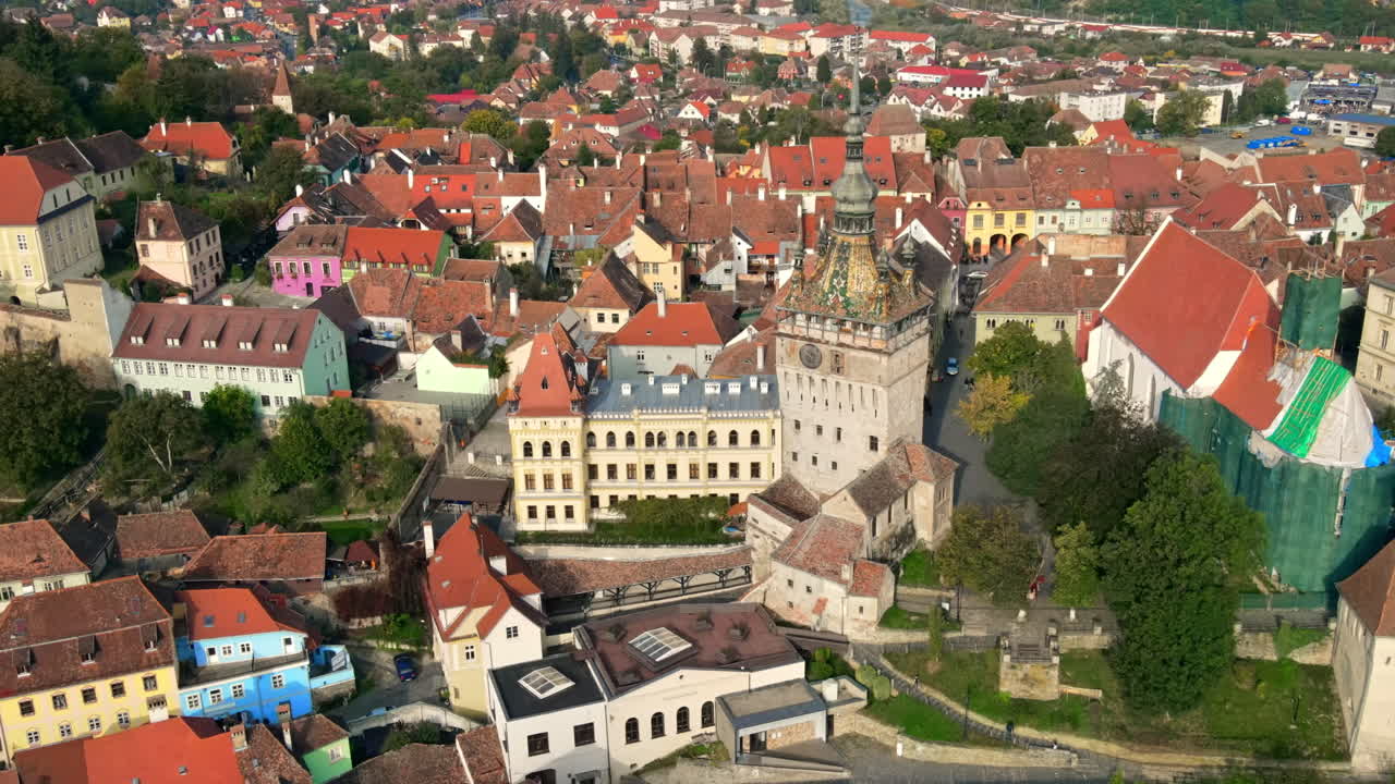Aerial drone view of the Historic Centre of Sighisoara, Romania. Old buildings, narrow streets, Sighisoara Clock Tower