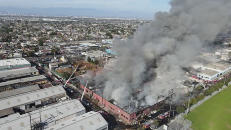 large commercial building up in flames