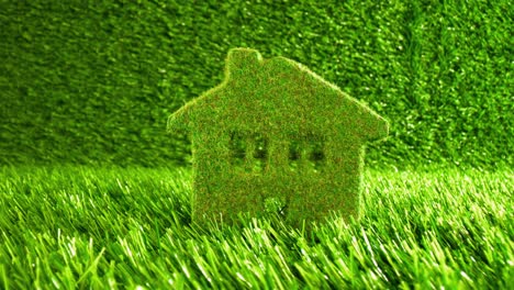 Little-Eco-House-on-the-green-grass.-Eco-concept-background.