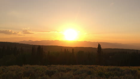 warm golden sky countryside mountain and forest during sunset