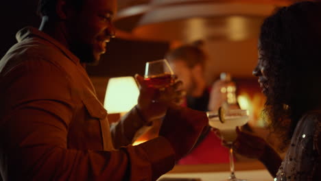 Relaxed-afro-couple-having-fun-in-restaurant.-Man-and-woman-dancing-in-nightclub