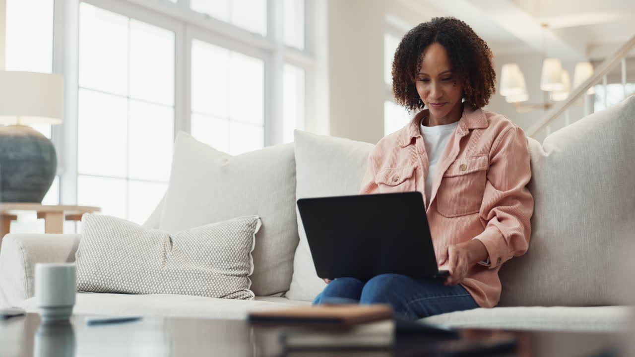 Woman working on her laptop from home