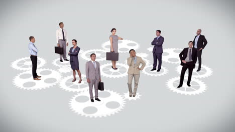 gente de negocios de pie en engranajes y ruedas en movimiento
