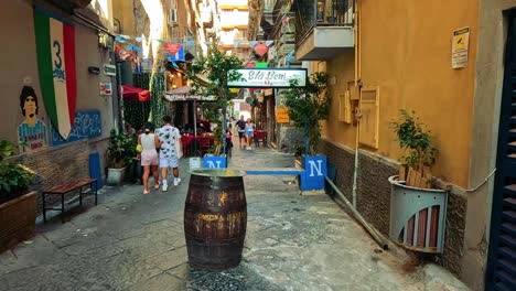 couple walking down a vibrant, narrow street