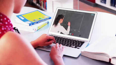 Caucasian-female-student-using-laptop-on-video-call-with-female-teacher