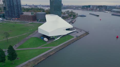 eye film museum cinema museum in amsterdam next to a water canal aerial view drone shot