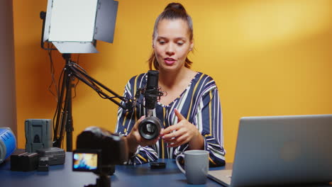 Influencer-showing-her-public-a-new-camera-lens