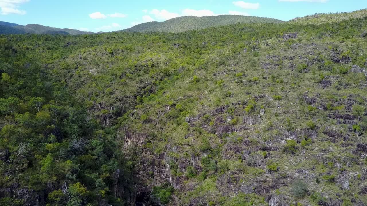 Reveal shot of a tropical scenery with mountains