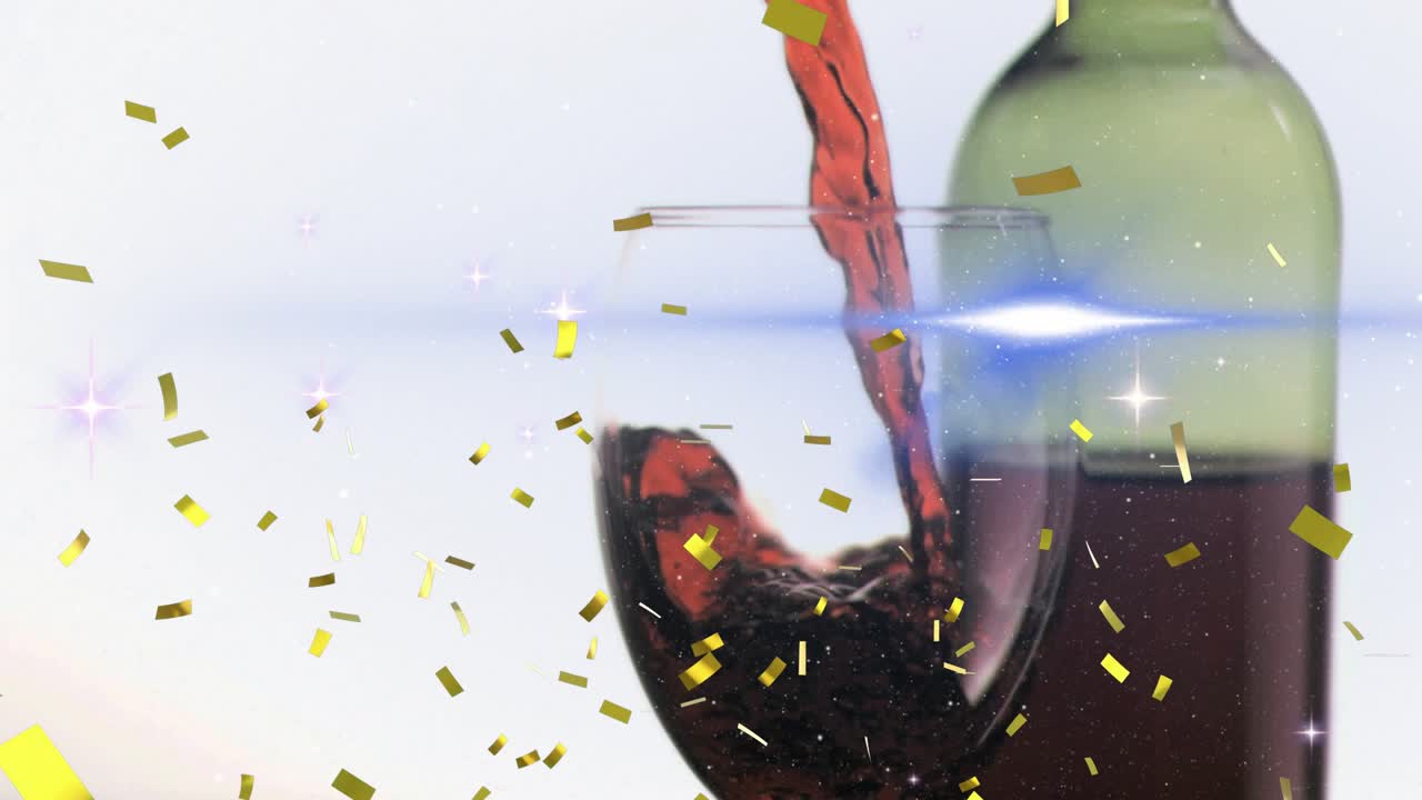 On bottle tipping, red wine pouring into clear stemmed glass, forming swirls to showcase product