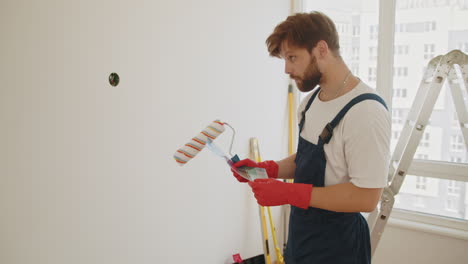 painter choosing paint color in a room