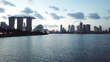 singapore skyline sunset marina bay sands panning forward, aerial 4k