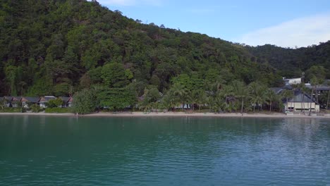 Gorgeous-aerial-top-view-flight-Huts-Resort-Beach-Bungalows,-Jungle-hilly-Island-Thailand-2022