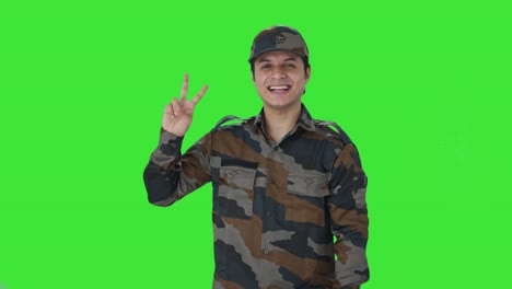 Happy-Indian-army-man-showing-victory-sign-Green-screen