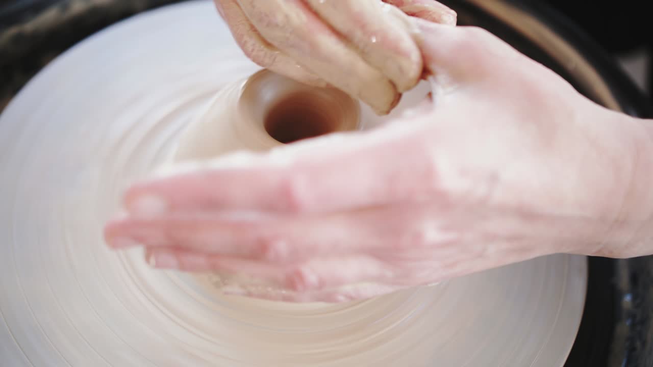 Potter's wheel potter works with his hands