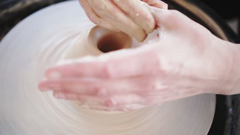potter's wheel potter works with his hands