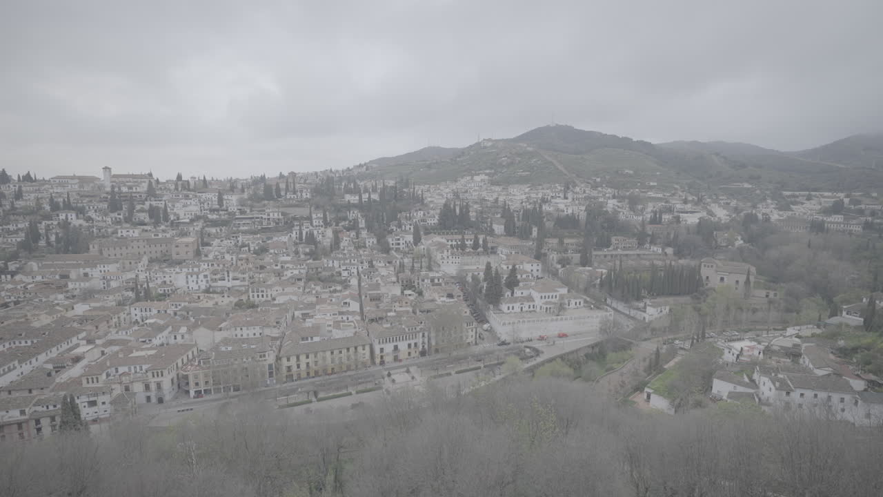 Panoramic view over Granada Spain on a cloudy day from a viewing point on the Alhambra LOG