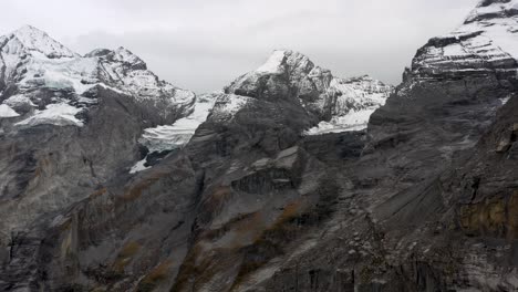 aerial view of glacier lake oeschinensee. mountains peaks. swiss alps, kandersteg, bernese oberland, europe. scenic footage of beautiful nature landscape