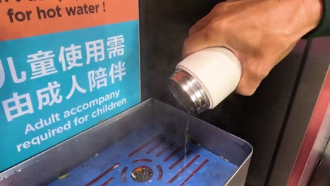 sequence of pouring hot water into a cup.