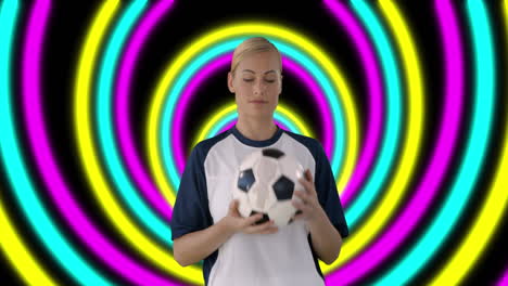 animation of caucasian female soccer with football smiling over shapes