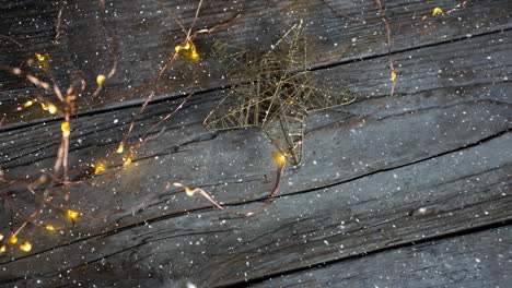 falling snow with christmas lights on wood