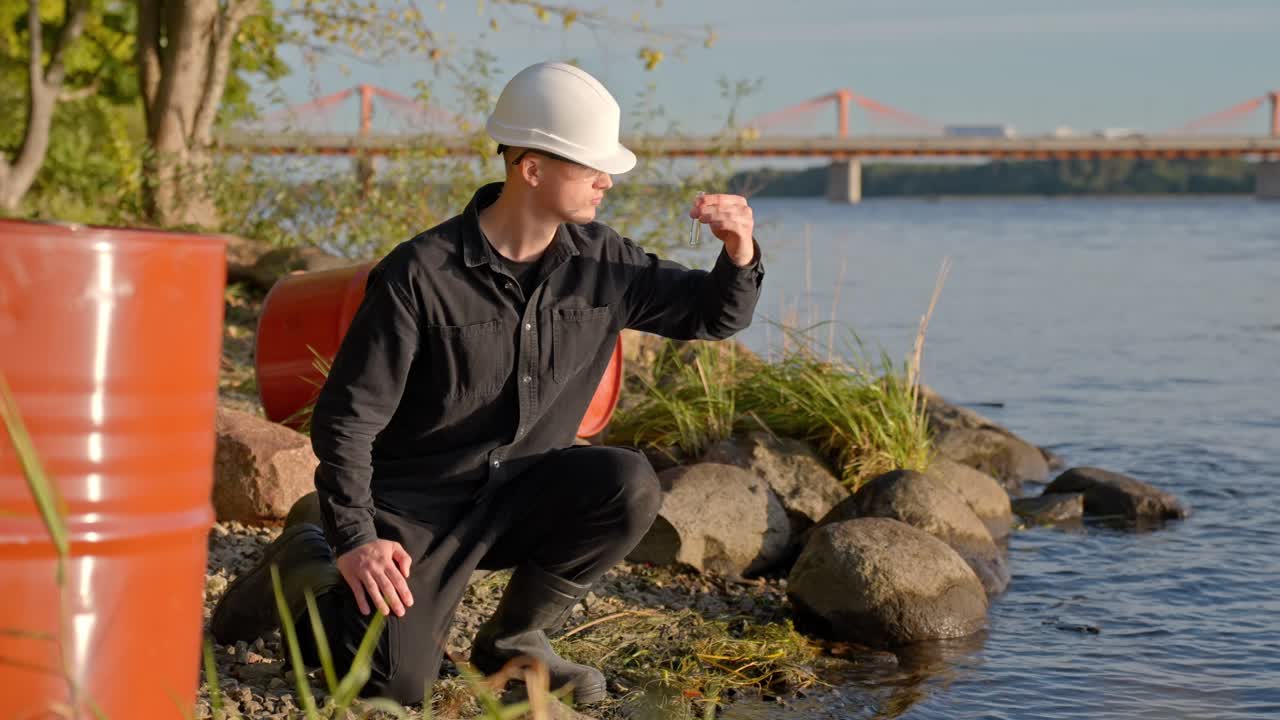 Testing water pollution by river, environmental concern, daytime