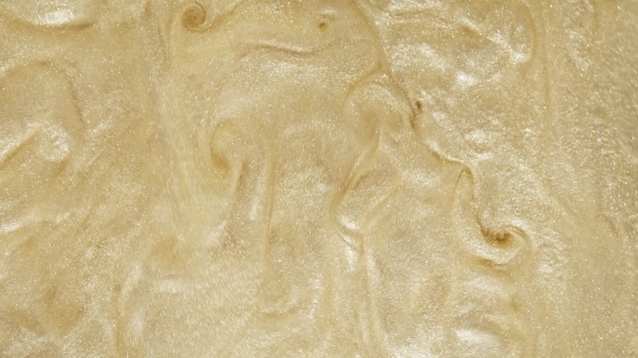 fondo de textura líquida de brillo dorado