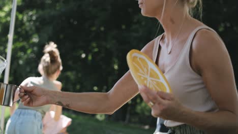 Video-of-parents-drink-the-juice-while-the-children-play