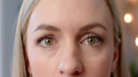 close-up of person's face, smiling and looking directly at camera