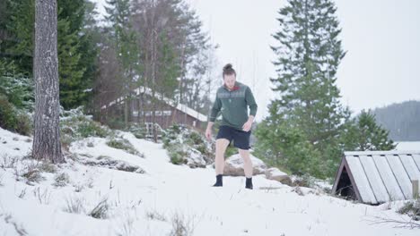 Caucasian-Man-Walking-At-Winter-Countryside-During-Snowfall-Day-In-Trondheim,-Norway