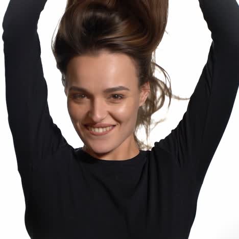 beautiful woman waving her hair. attractive woman shaking her hair on white background in slow motion.