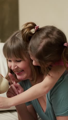 grandmother and granddaughter playing