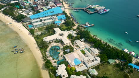 aerial footage of beach shore and many sailing boats in krabi