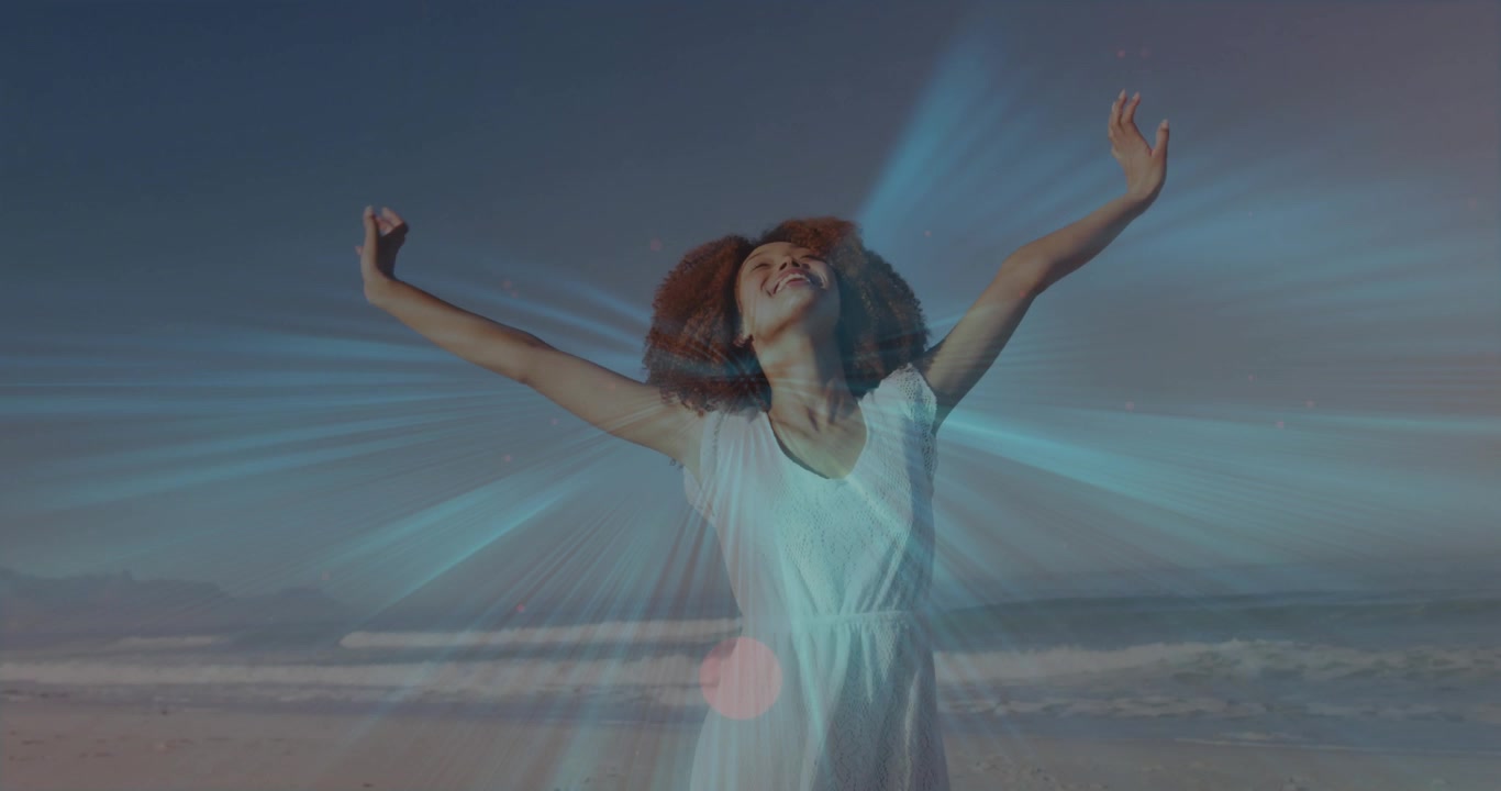 Woman starting hands behind head, raising arms upward, tilting head back, showing release on beach