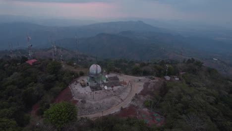 Orbit-drone-shot-of-Cerro-Azul,-a-fishing-village-that-was-once-a-commercial-port-in-Cañete-Province,-Lima-Region,-Peru