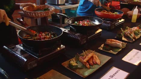 Rows-of-cooking-station-busy-preparing-traditional-khmer-dishes