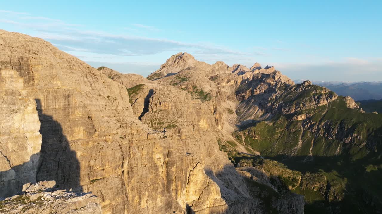 High-flying drone shot capturing the intricate textures of the Dolomites, from its deep crevices to its towering spires, showcasing nature's artistry at its finest