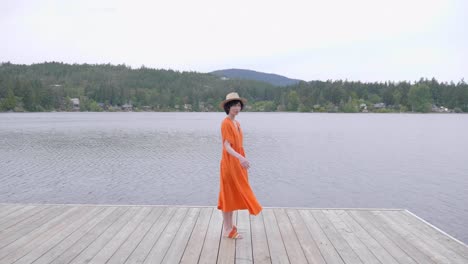 pretty caucasian girl at fashion shoot posing by the lake