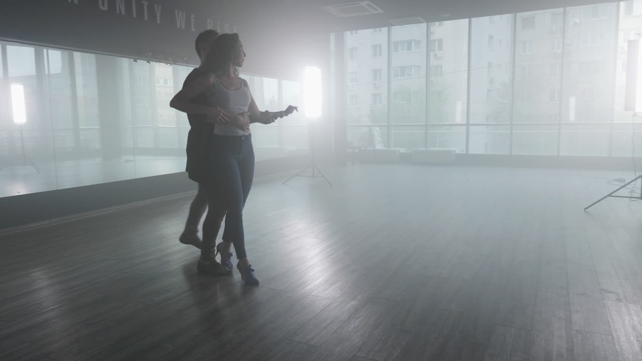 Couple dancing in studio